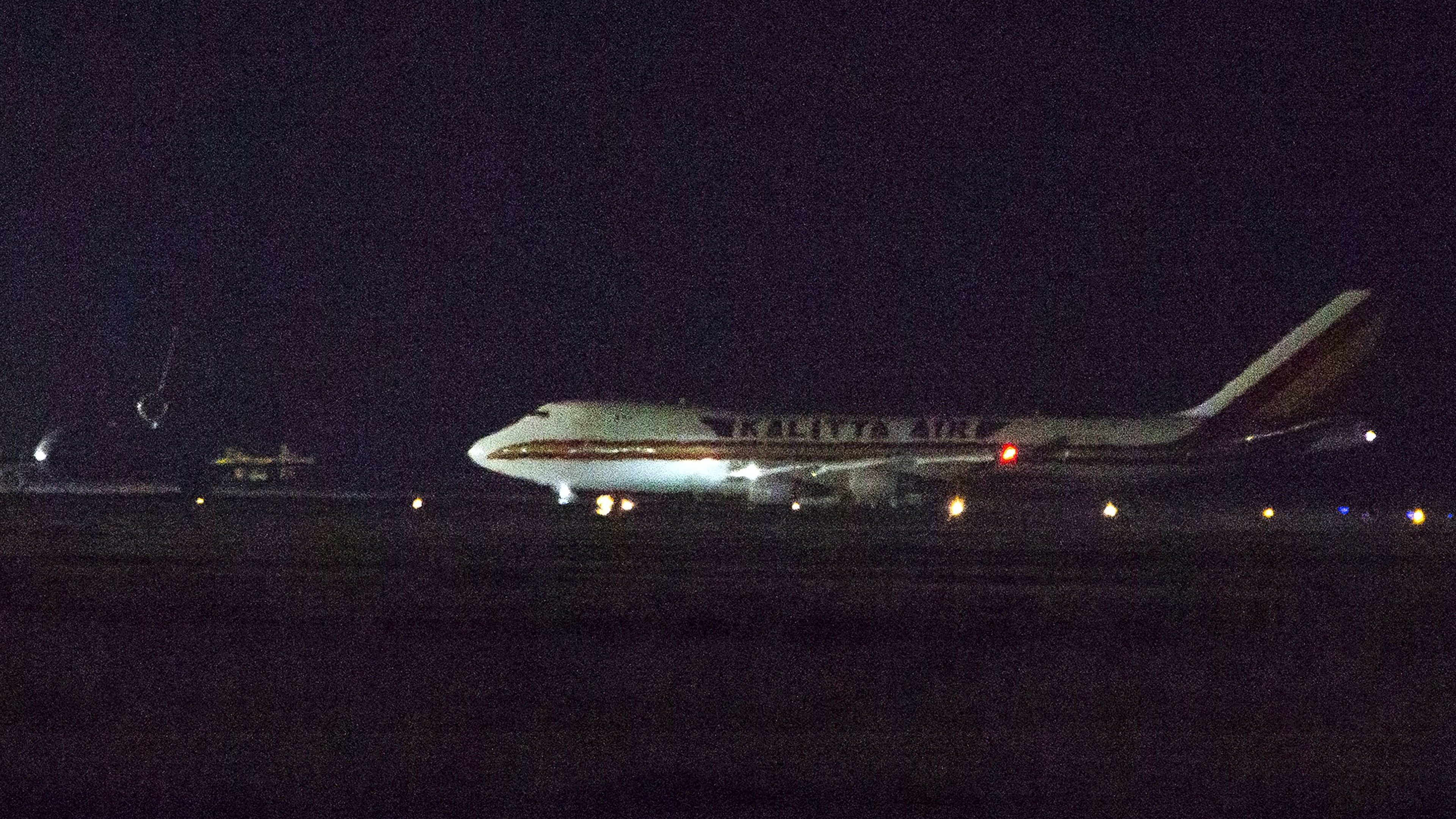 A plane carrying American passengers, who were recently released from the Diamond Princess cruise ship in Japan, arrives at Travis Air Force Base in California on February 16, 2020. (Credit: Brittany Hosea-Small/AFP/Getty Images)