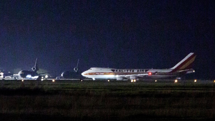 A plane carrying American passengers, who were recently released from the Diamond Princess cruise ship in Japan, arrives at Travis Air Force Base in California on February 16, 2020. (Credit: Brittany Hosea-Small/AFP/Getty Images)