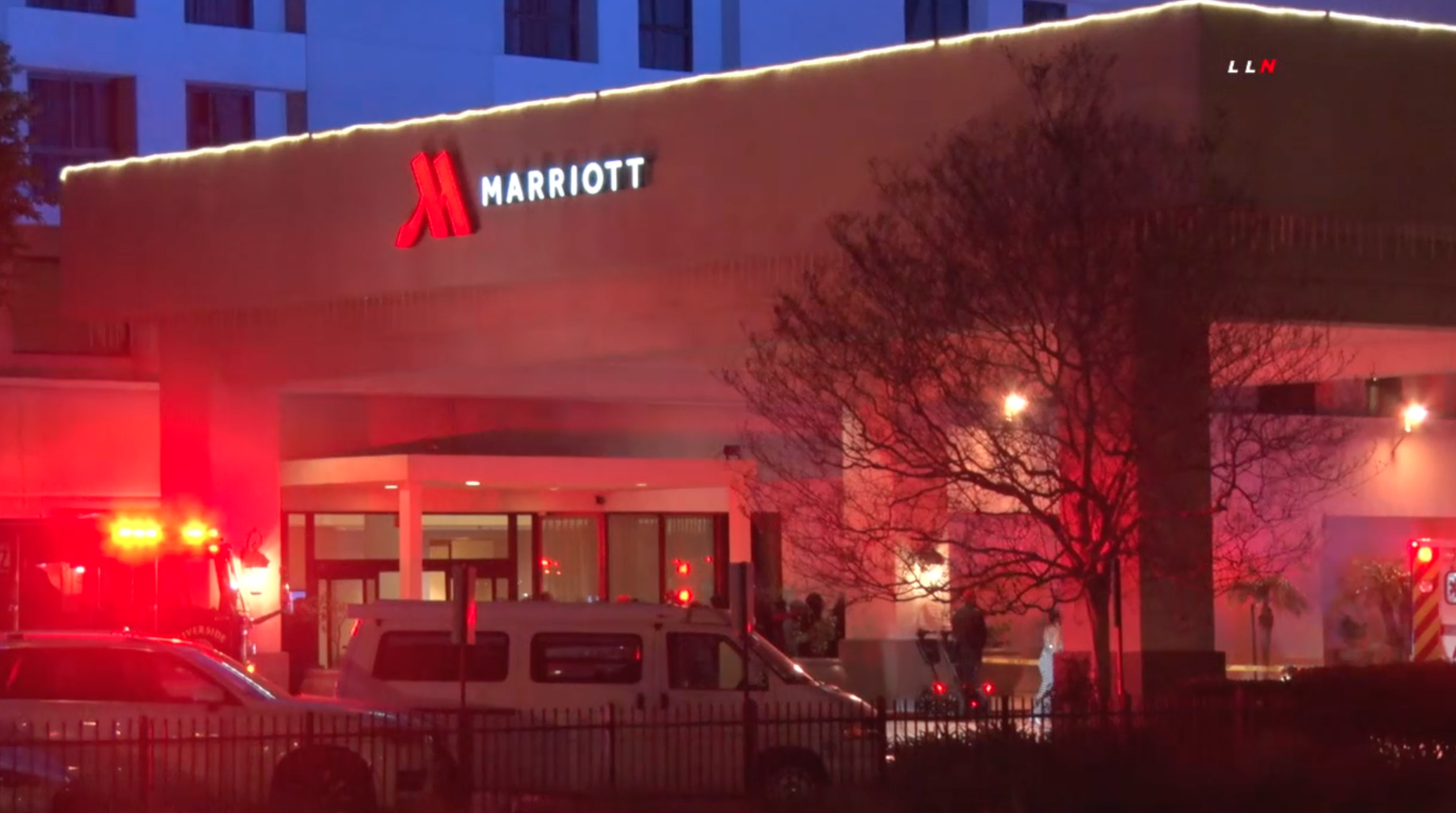 An ambulance is seen outside the the Marriott Riverside at the Convention Center, where a deadly shooting occurred on Feb. 14, 2020. (Credit: Loudlabs)