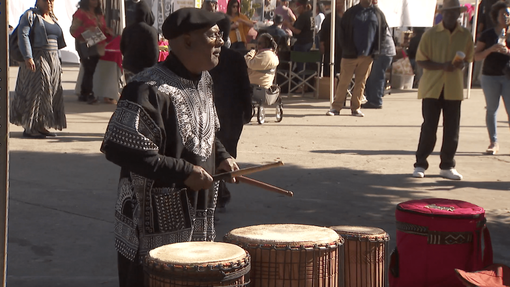 A man plays the drums during a Black History Month celebration in Leimert Park on Feb. 16, 2020.