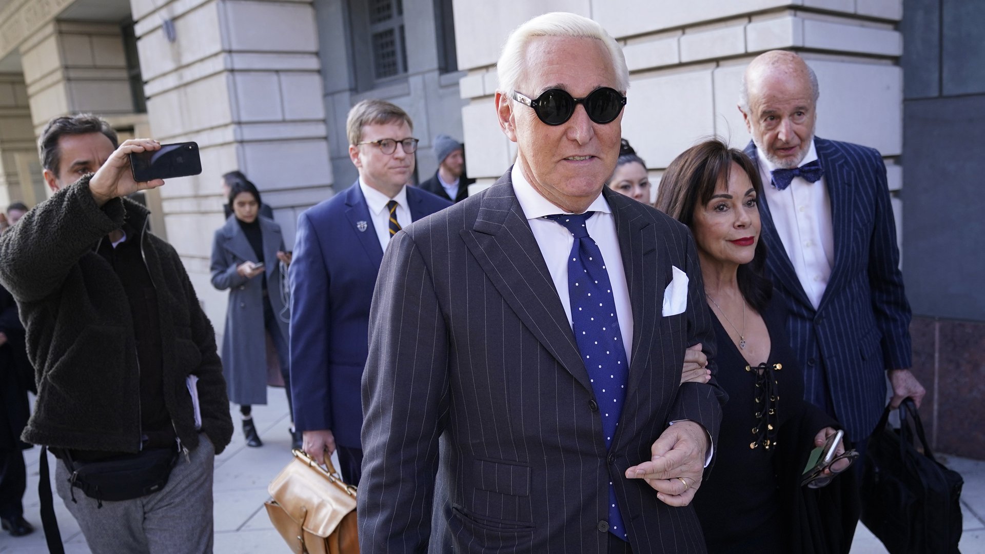 Former advisor to U.S. President Donald Trump, Roger Stone, departs the E. Barrett Prettyman United States Courthouse with his wife Nydia after being found guilty of obstructing a congressional investigation into Russia’s interference in the 2016 election on November 15, 2019 in Washington, DC. (Credit: Win McNamee/Getty Images)