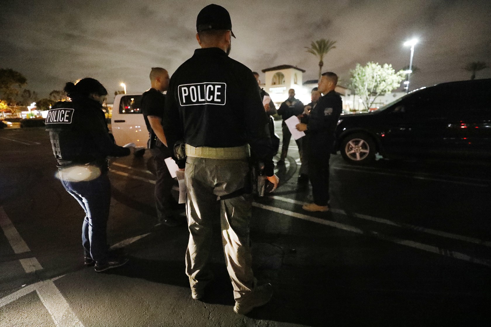 On the way to conduct immigration raids on March 16, 2020, officers passed freeway signs reading "Wash your hands stay healthy avoid COVID-19." (Al Seib/Los Angeles Times)