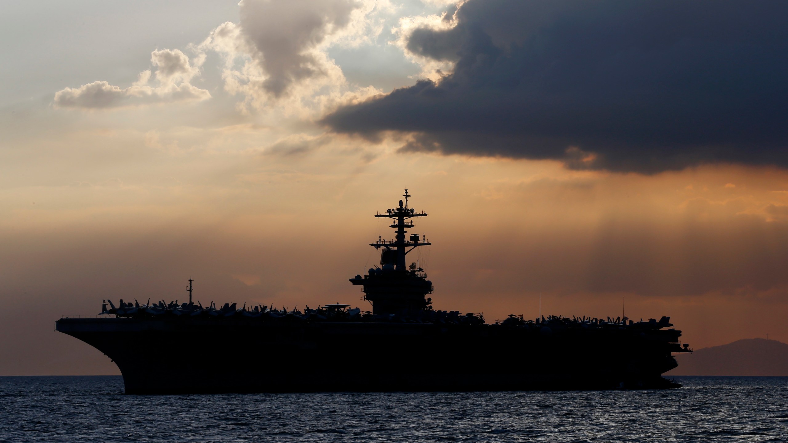 The USS Theodore Roosevelt aircraft carrier anchored off Manila Bay west of Manila, Philippines in 2018. (AP Photo/Bullit Marquez, File)