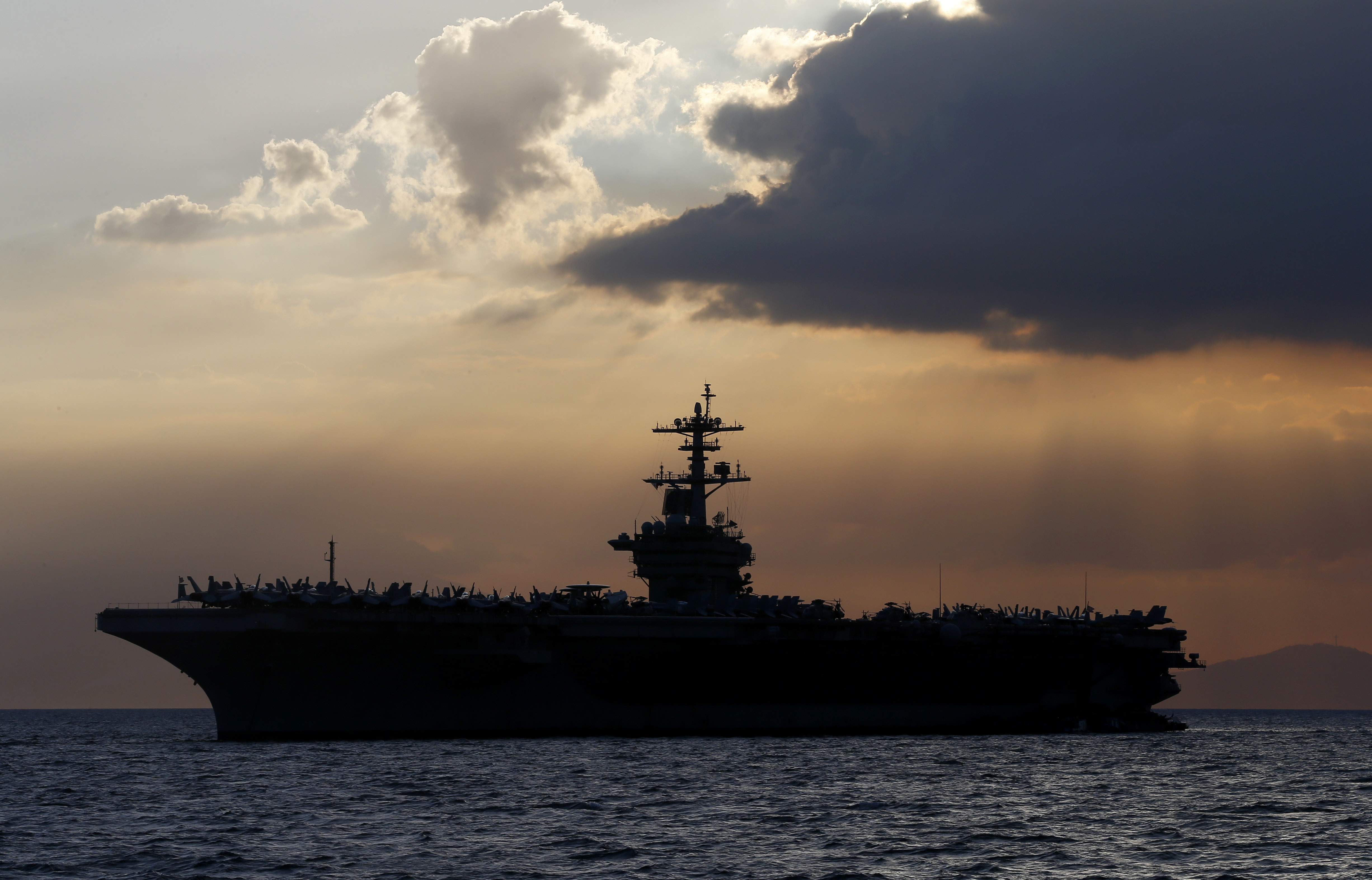 The USS Theodore Roosevelt aircraft carrier anchored off Manila Bay west of Manila, Philippines in 2018. (AP Photo/Bullit Marquez, File)