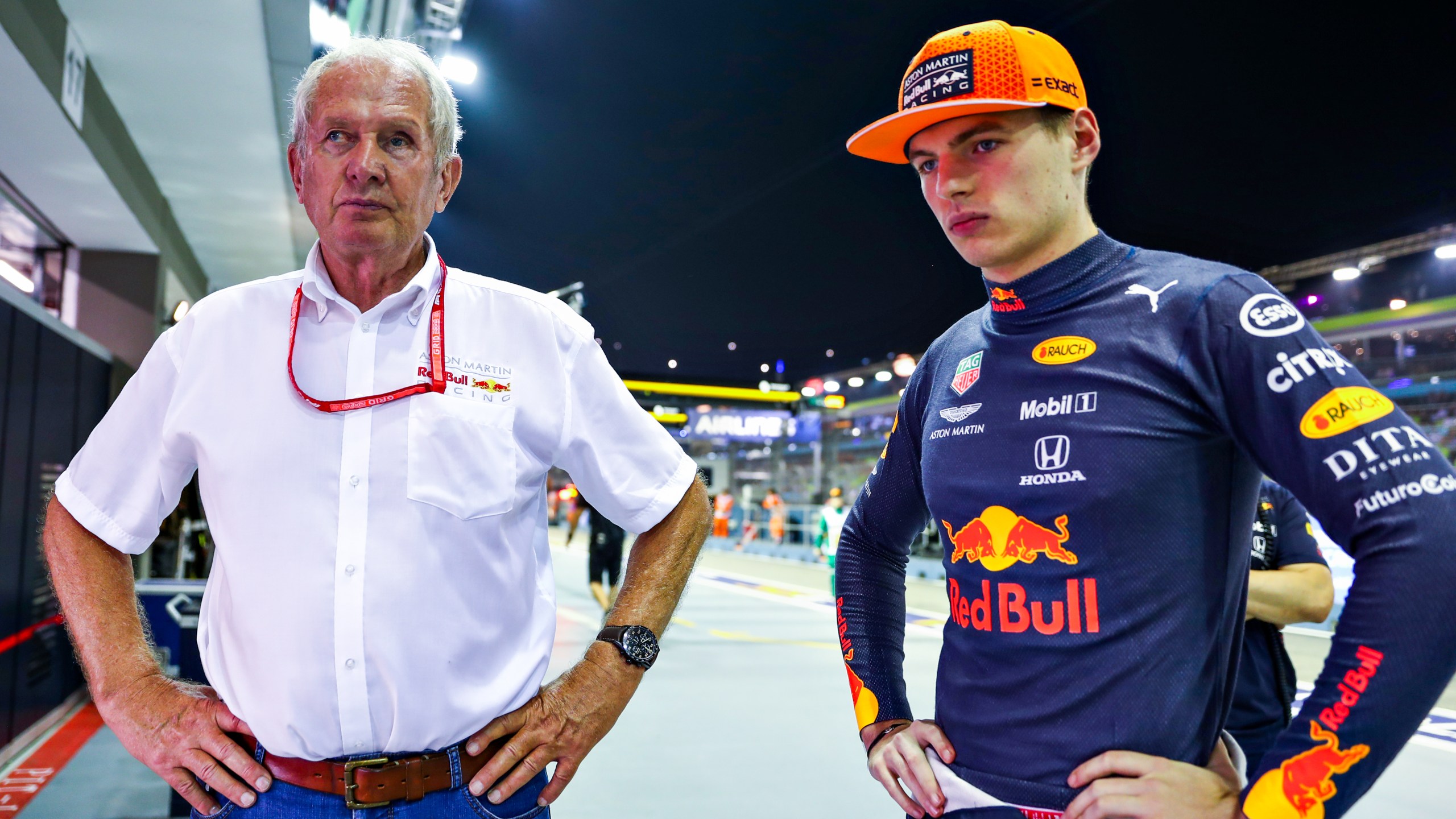 Max Verstappen of Netherlands, right, and Red Bull racing team consultant Helmut Marko look on during a qualifying race for the F1 Grand Prix of Singapore at Marina Bay Street Circuit on Sept. 21, 2019 in Singapore. (Mark Thompson/Getty Images)