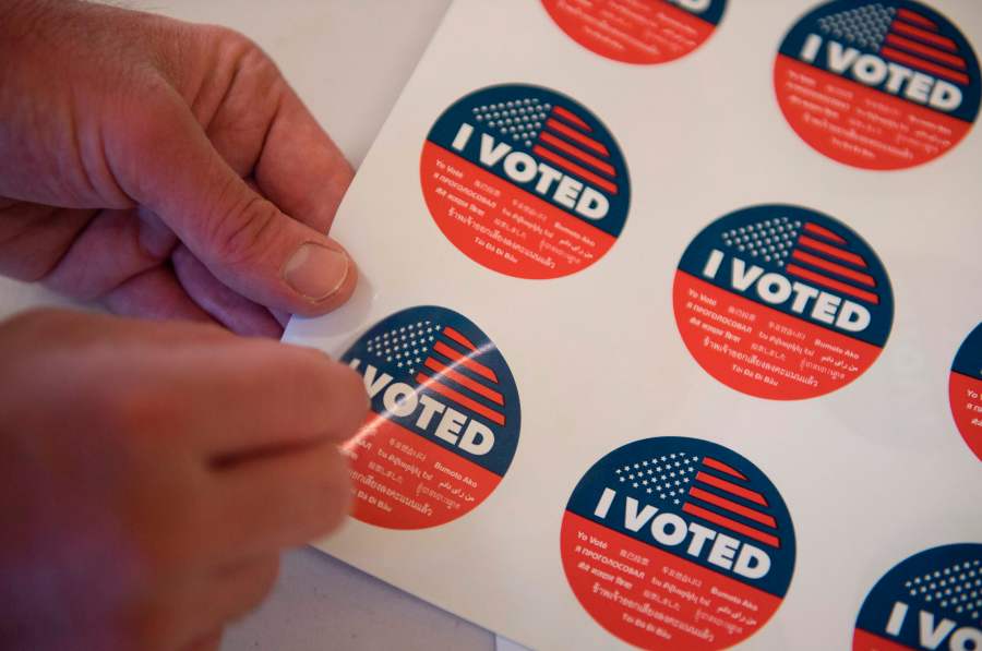 Voting stickers are displayed during early voting for the California primary in Los Angeles on March 1, 2020. (Credit: Mark Ralston / AFP / Getty Images)