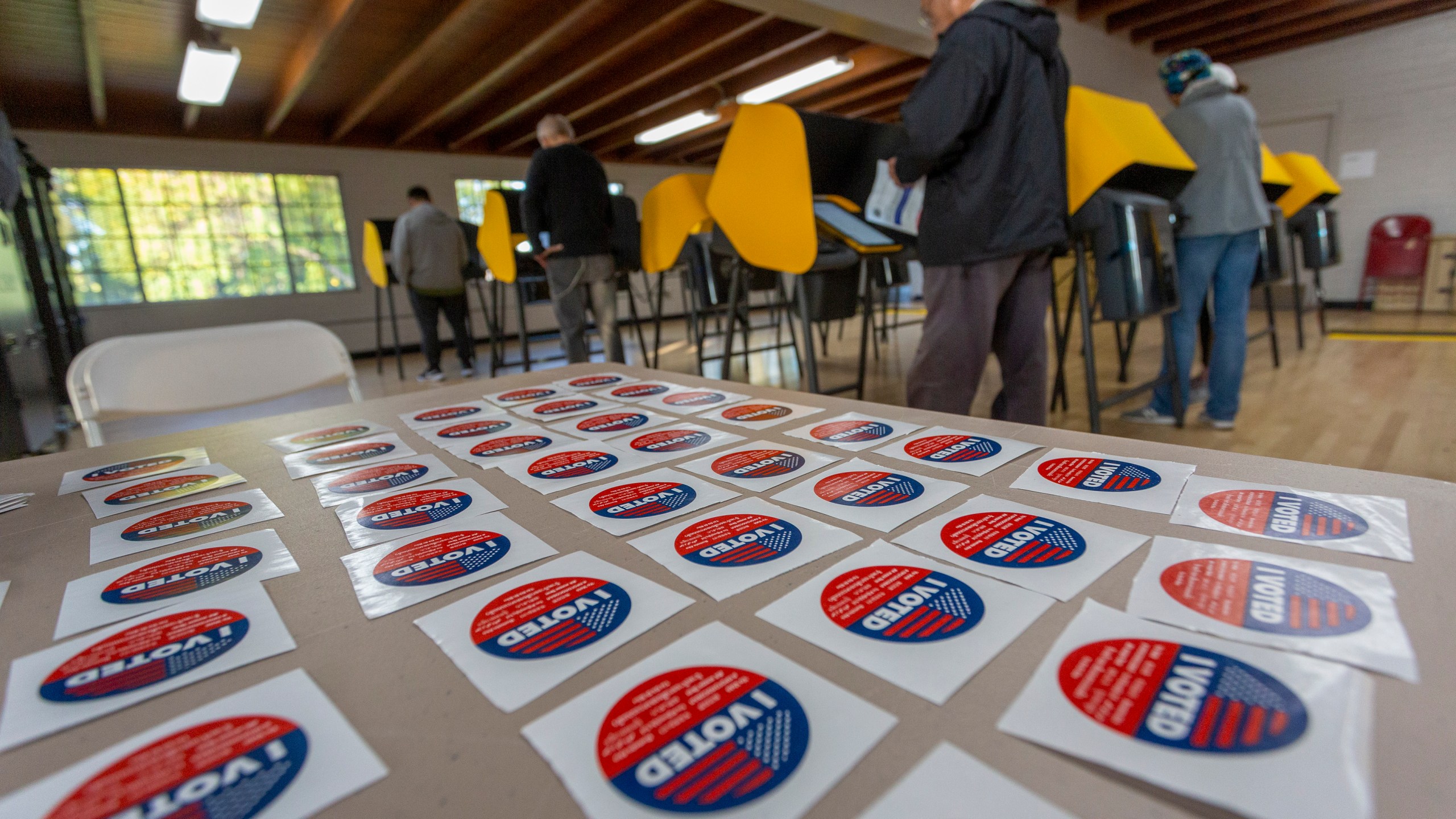 Voters cast their ballots at a voting center at Granada Park on March 3, 2020 in Alhambra. (David McNew/Getty Images)