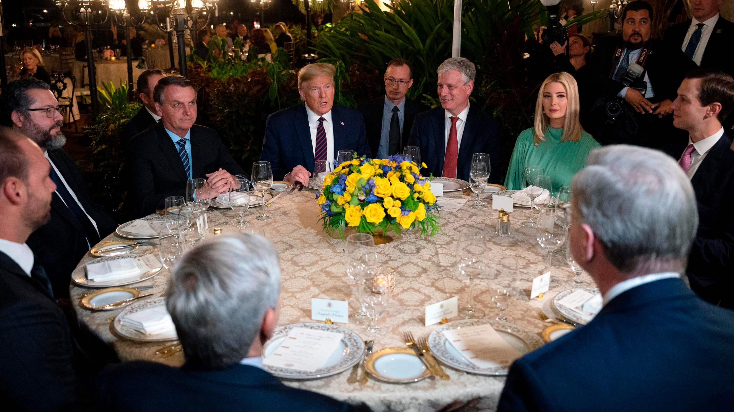 President Donald Trump (C) speaks with Brazilian President Jair Bolsonaro (L), alongside United States National Security Advisor Robert O'Brien (3rd R), Advisor to the President Ivanka Trump (2nd R) and Senior Advisor Jared Kushner (R), during a diner at Mar-a-Lago in Palm Beach, Florida, on March 7, 2020. (JIM WATSON/AFP via Getty Images)