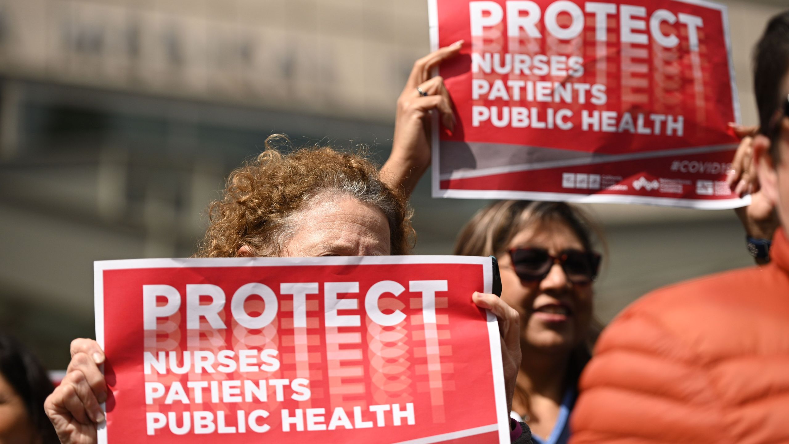 Nurses protest to oppose what they call the Center for Disease Control's weak response to the novel coronavirus, n March 11, 2020, outside the UCLA Medical Center in Los Angeles. (ROBYN BECK/AFP via Getty Images)