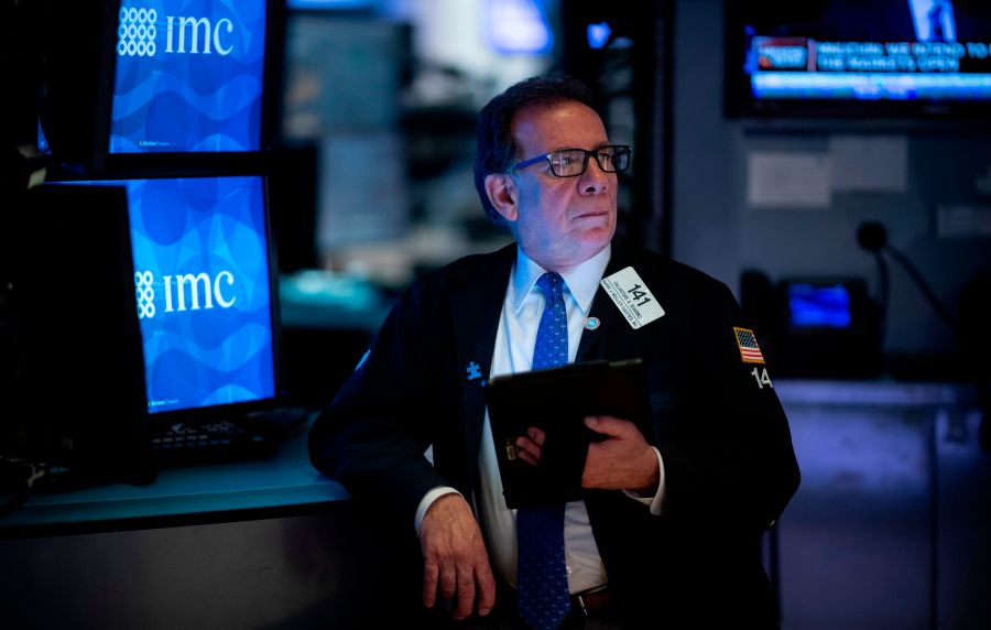 Traders work during the opening bell at the New York Stock Exchange on March 13, 2020, at Wall Street in New York City. (Johannes Eisele/AFP via Getty Images)