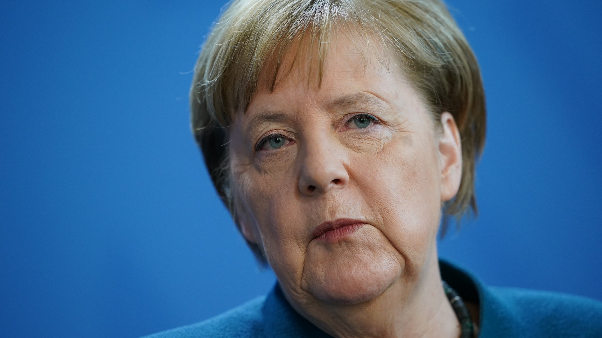 German Chancellor Angela Merkel speaks to reporters to announce further measures to combat the spread of the coronavirus and COVID-19, the disease the virus causes, after she held a teleconference with the governors of Germany's 16 states on March 22, 2020, in Berlin, Germany. (Clemens Bilan - Pool/Getty Images)