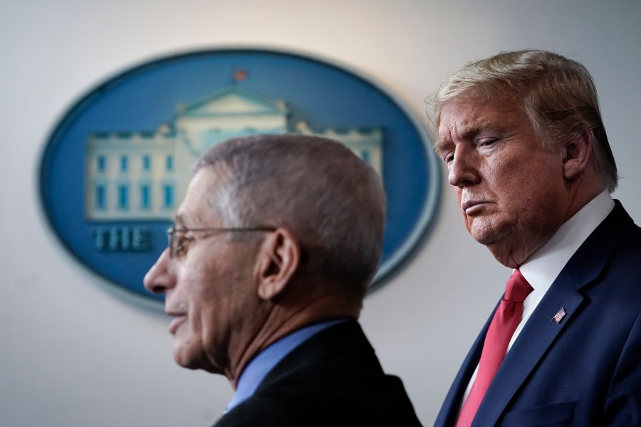 Dr. Anthony Fauci, director of the National Institute of Allergy and Infectious Diseases, speaks as President Donald Trump looks on during a briefing on the coronavirus pandemic, in the press briefing room of the White House on March 24, 2020. (Drew Angerer/Getty Images)