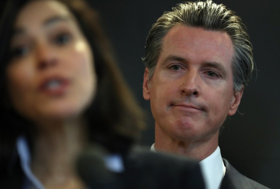 California Gov. Gavin Newsom looks on as California Department of Public Health Director Dr. Sonia Angell speaks during a news conference in Sacramento on Feb. 27, 2020. (Credit: Justin Sullivan / Getty Images)