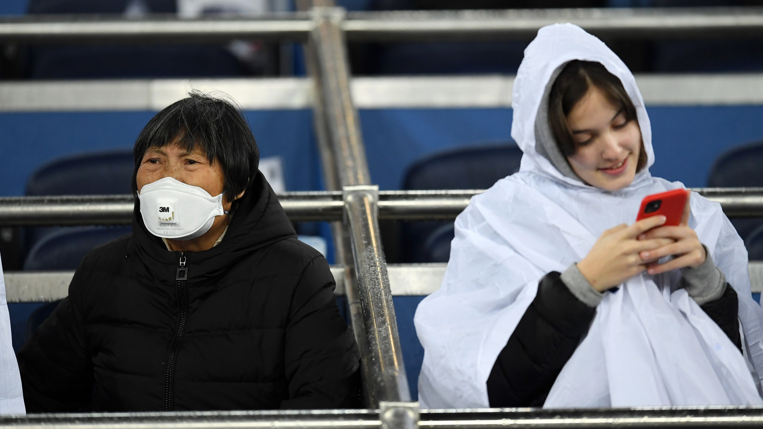 A fan wears a 3M Aura Disposable Respirator as they await kickoff prior to the Liga match between Real Madrid CF and FC Barcelona at Estadio Santiago Bernabeu on March 1, 2020 in Madrid, Spain. (David Ramos/Getty Images)