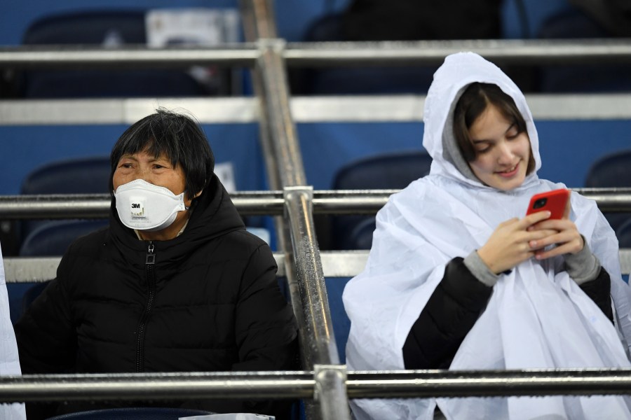 A fan wears a 3M Aura Disposable Respirator as they await kickoff prior to the Liga match between Real Madrid CF and FC Barcelona at Estadio Santiago Bernabeu on March 1, 2020 in Madrid, Spain. (David Ramos/Getty Images)