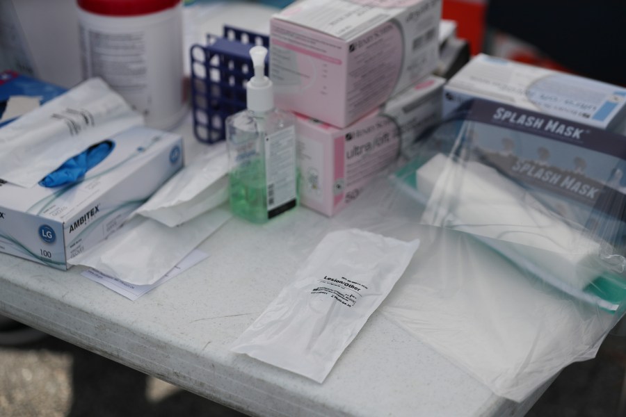 A coronavirus test kit is seen in its protective pouch on a table as health care staff members from the FoundCare center help people who called to setup a drive through appointments to be tested for the coronavirus in the centers parking lot on March 16, 2020 in West Palm Beach, Florida. (Joe Raedle/Getty Images)