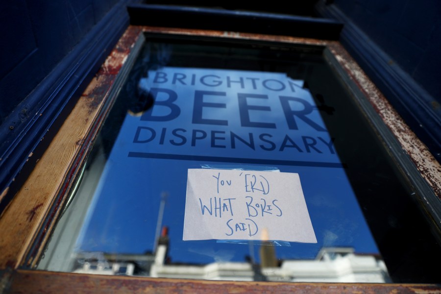 A sign on the front door of the Brighton Beer Dispensary displaying the message "You 'erd what Boris said" informs customers that the pub has closed on March 23, 2020 in Brighton, United Kingdom. (Dan Istitene/Getty Images)