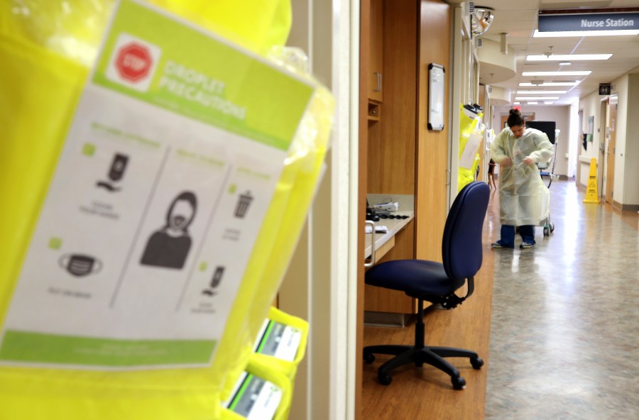 Nurses in the COVID-19 unit of MedStar St. Mary's Hospital dress in personal protective equipment before entering a patient's room March 24, 2020 in Leonardtown, Maryland. (Win McNamee/Getty Images)