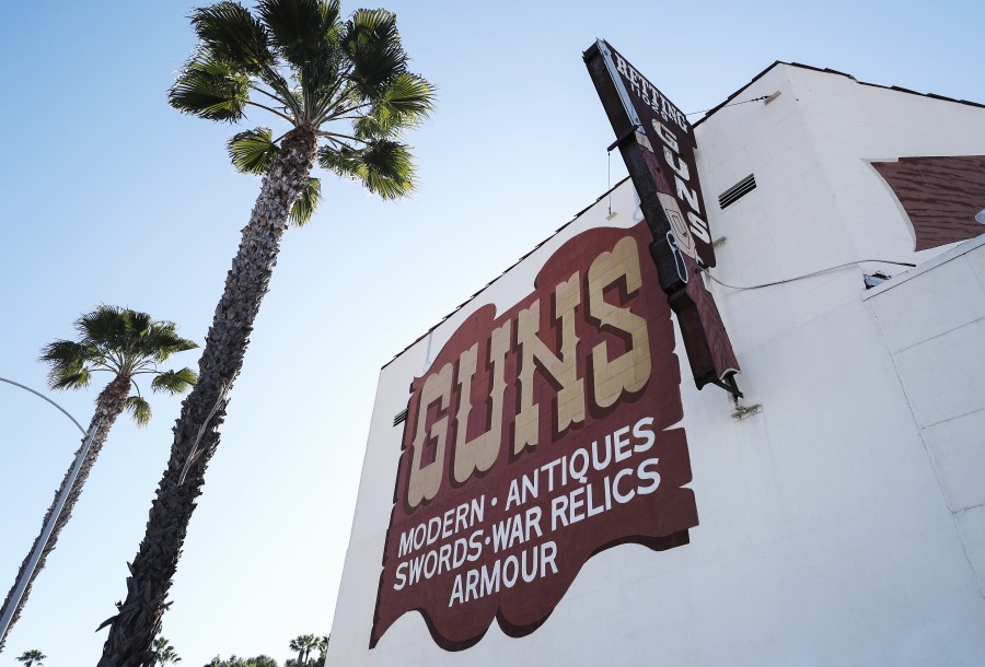 Palm trees stand next to the Martin B. Retting, Inc. guns store as the coronavirus pandemic continues on March 24, 2020, in Culver City. (Mario Tama/Getty Images)