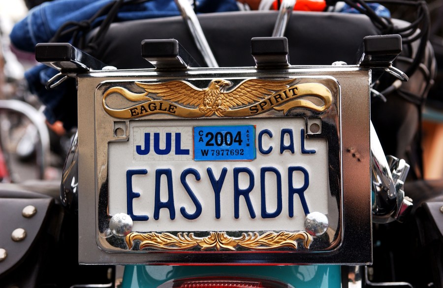 A vanity license plate sits on a Harley-Davidson motorcycle in Glendale on Nov. 9, 2003. (Credit: Amanda Edwards / Getty Images)