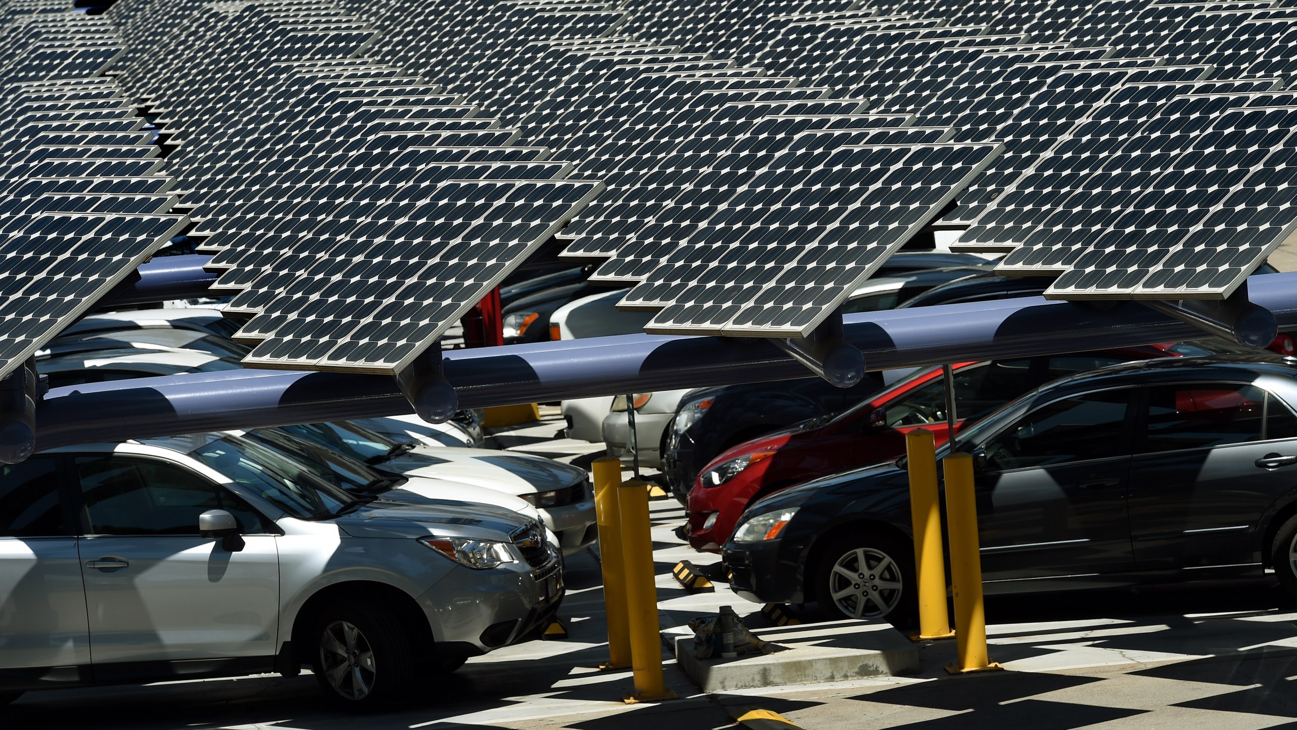 Solar panels used to generate power outside an office building in Los Angeles on Aug. 4, 2015. (MARK RALSTON/AFP via Getty Images)