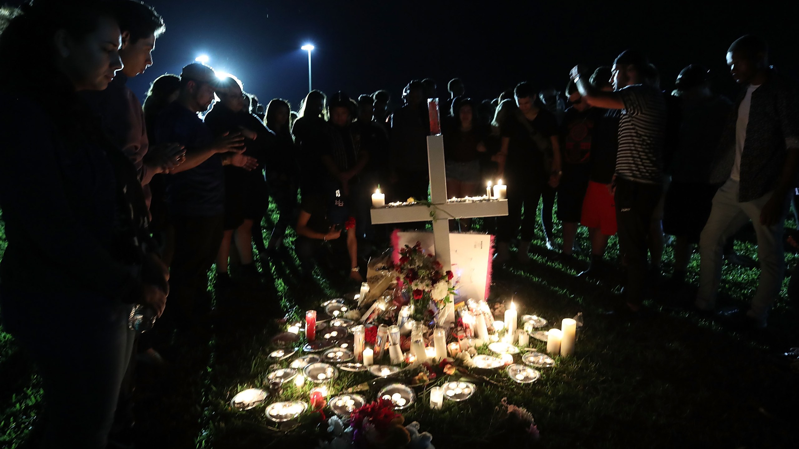 Students, friends and family gather for a candlelight vigil for victims a day after the mass shooting at Marjory Stoneman Douglas High School in Parkland, Florida, on Feb. 15, 2018. (Credit: Mark Wilson / Getty Images)