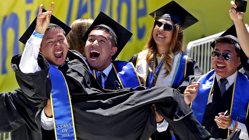 UC Irvine graduates celebrate in 2014. The school has canceled its traditional commencement ceremonies for the first time in its 55-year history.(Irfan Khan/Los Angeles Times)