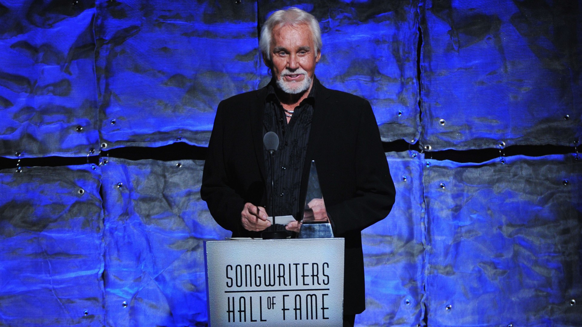 Kenny Rogers speaks onstage at the Songwriters Hall of Fame 43rd Annual induction and awards at The New York Marriott Marquis on June 14, 2012 in New York City. (Theo Wargo/Getty Images for Songwriters Hall Of Fame)