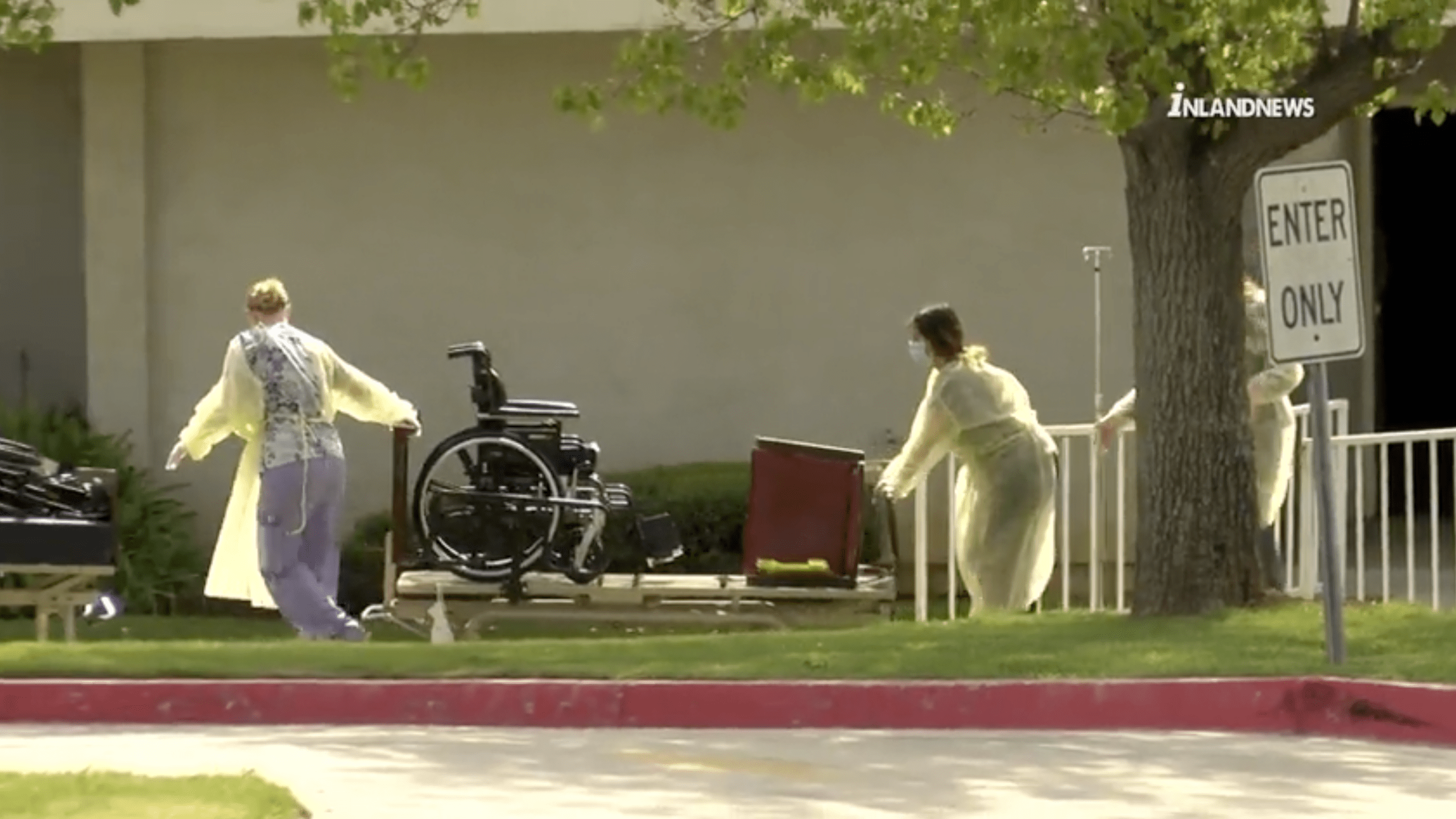 Staff is seen bringing out wheelchairs and beds from the Cedar Mountain Post Acute nursing home in Yucaipa after one death and 12 COVID-19 cases were confirmed on March 28, 2020. (Inland News)