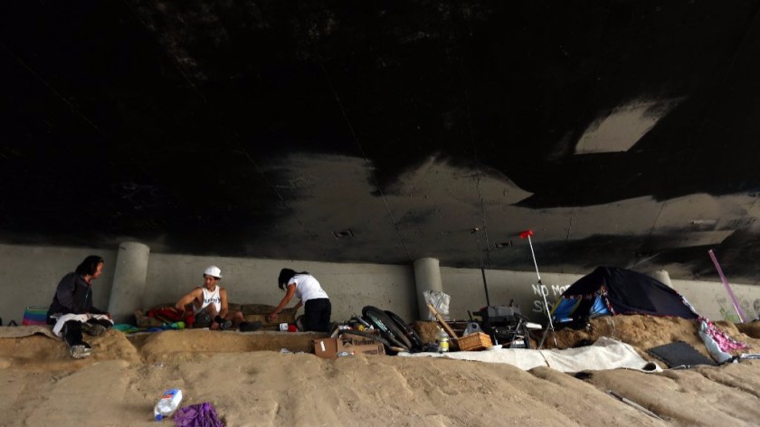 A homeless encampment beneath the 110 Freeway in Harbor City is seen in this undated photo. (Credit: Genaro Molina / Los Angeles Times)