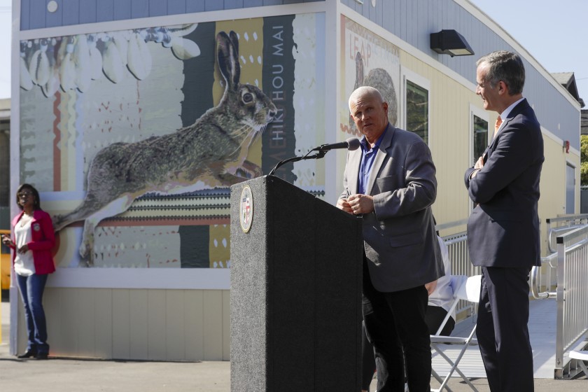 L.A. City Councilman Mike Bonin, left, and Mayor Eric Garcetti at the grand opening of Pacific Sunset, a 154-bed bridge home shelter in Venice.(Credit: Irfan Khan / Los Angeles Times)