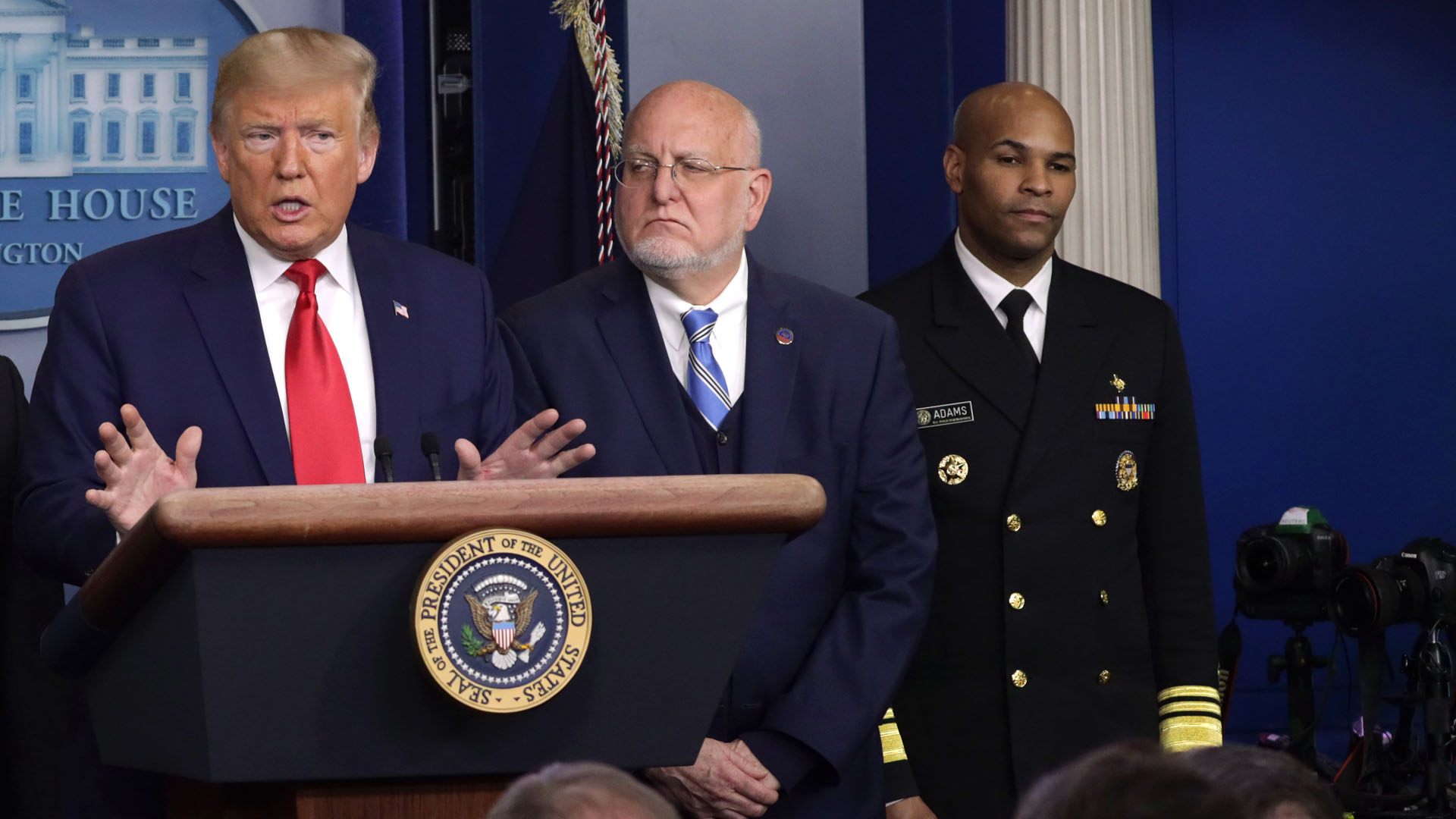 U.S. Surgeon General Jerome Adams, far right, stands beside Centers for Disease Control and Prevention Director Robert Redfield as President Donald Trump discusses the coronavirus outbreak during a news conference at the White House on Feb. 29, 2020. (Alex Wong/Getty Images)