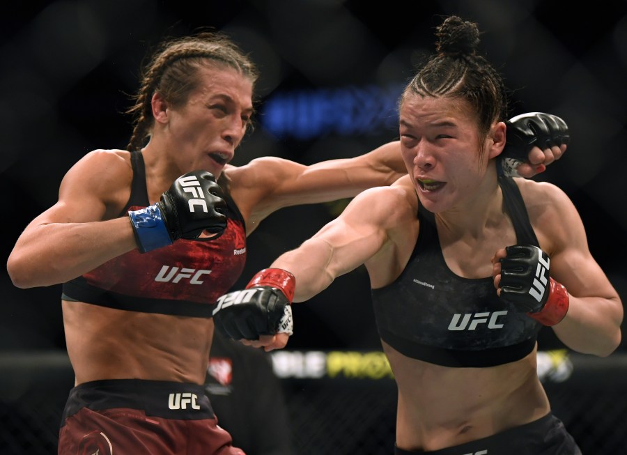 Weili Zhang punches Joanna Jedrzejczyk during UFC 248, the last UFC event to take place in front of fans. (Harry How/Getty Images North America/Getty Images)