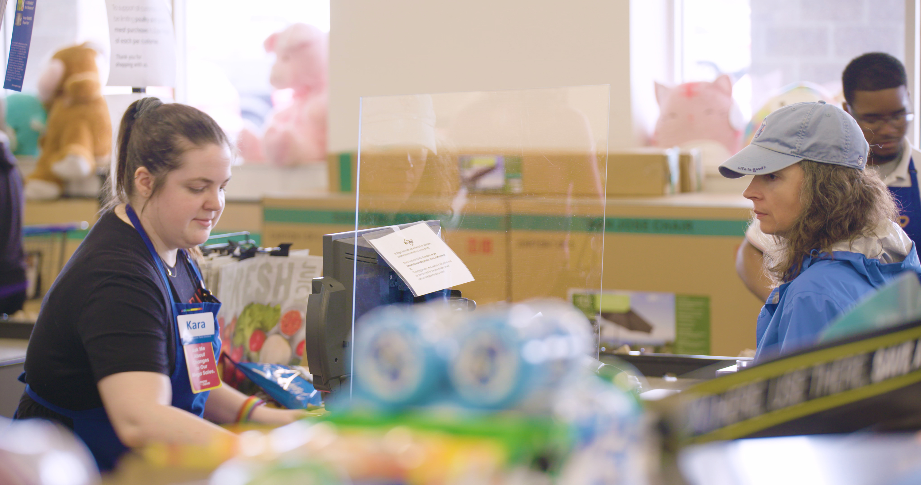 A sneeze guard is seen at a checkout lane at Kroger in this photo provided by the company.