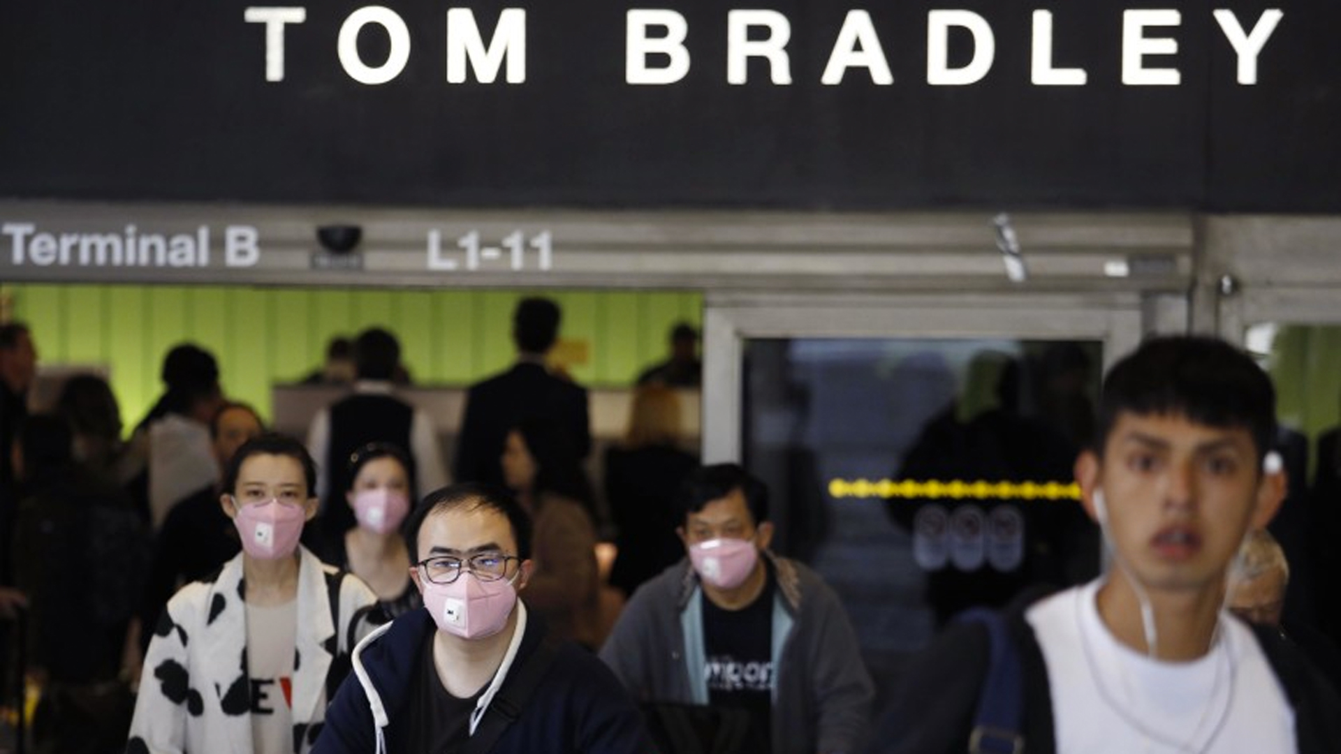 Travelers arrive at the Tom Bradley International Terminal at Los Angeles International Airport last month.(Genaro Molin / Los Angeles Times)