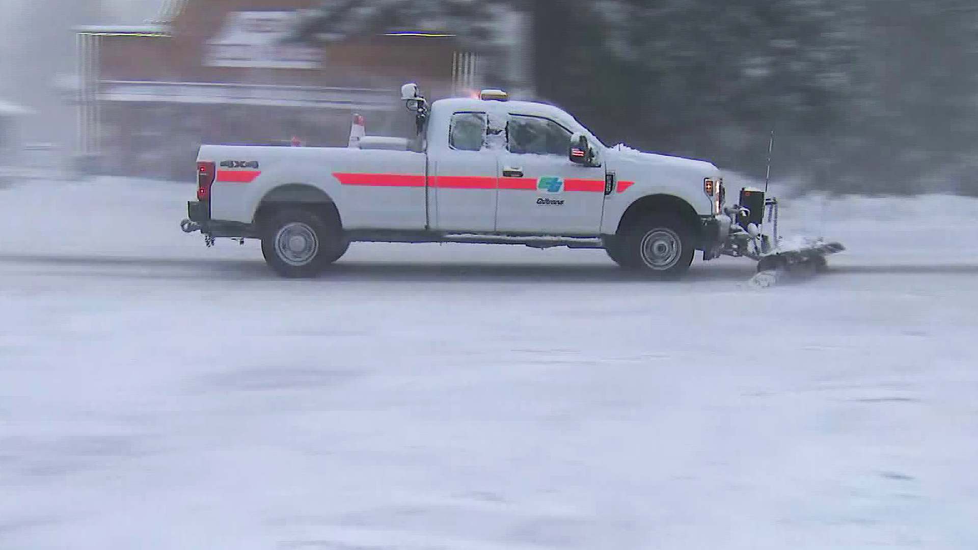 A truck plows the icy roads in Running Springs on March 2, 2020. (KTLA)