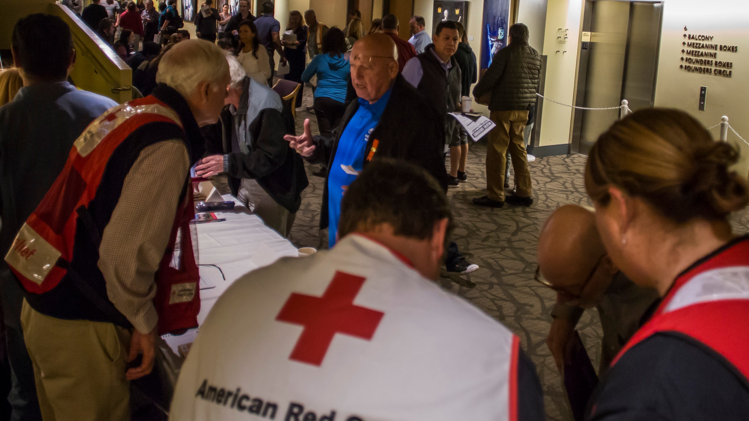 Members of the American Red Cross speak to wildfire victims at a town hall in Thousand Oaks on Nov. 14, 2018. (Credit: Apu Gomes / AFP / Getty Images)