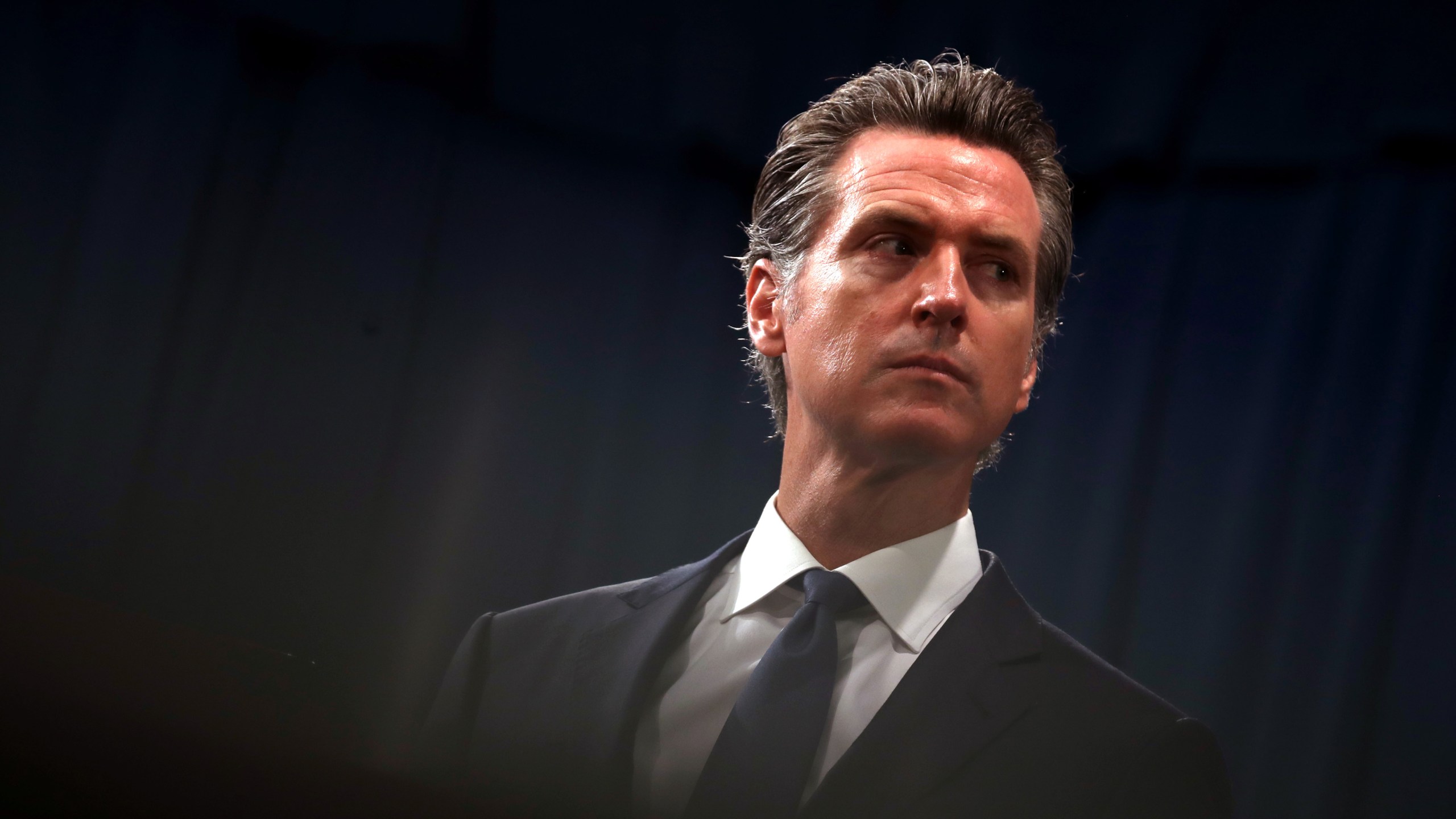 Gov. Gavin Newsom looks on during a news conference with California Attorney General Xavier Becerra in Sacramento on Aug. 16, 2019. (Justin Sullivan / Getty Images)