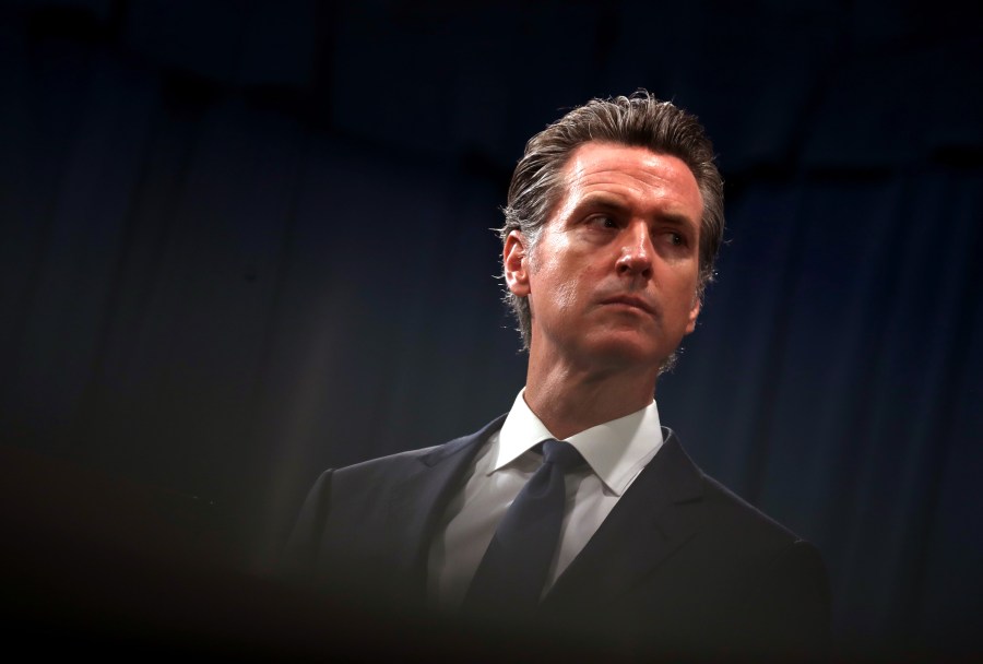 Gov. Gavin Newsom looks on during a news conference with California Attorney General Xavier Becerra in Sacramento on Aug. 16, 2019. (Justin Sullivan / Getty Images)