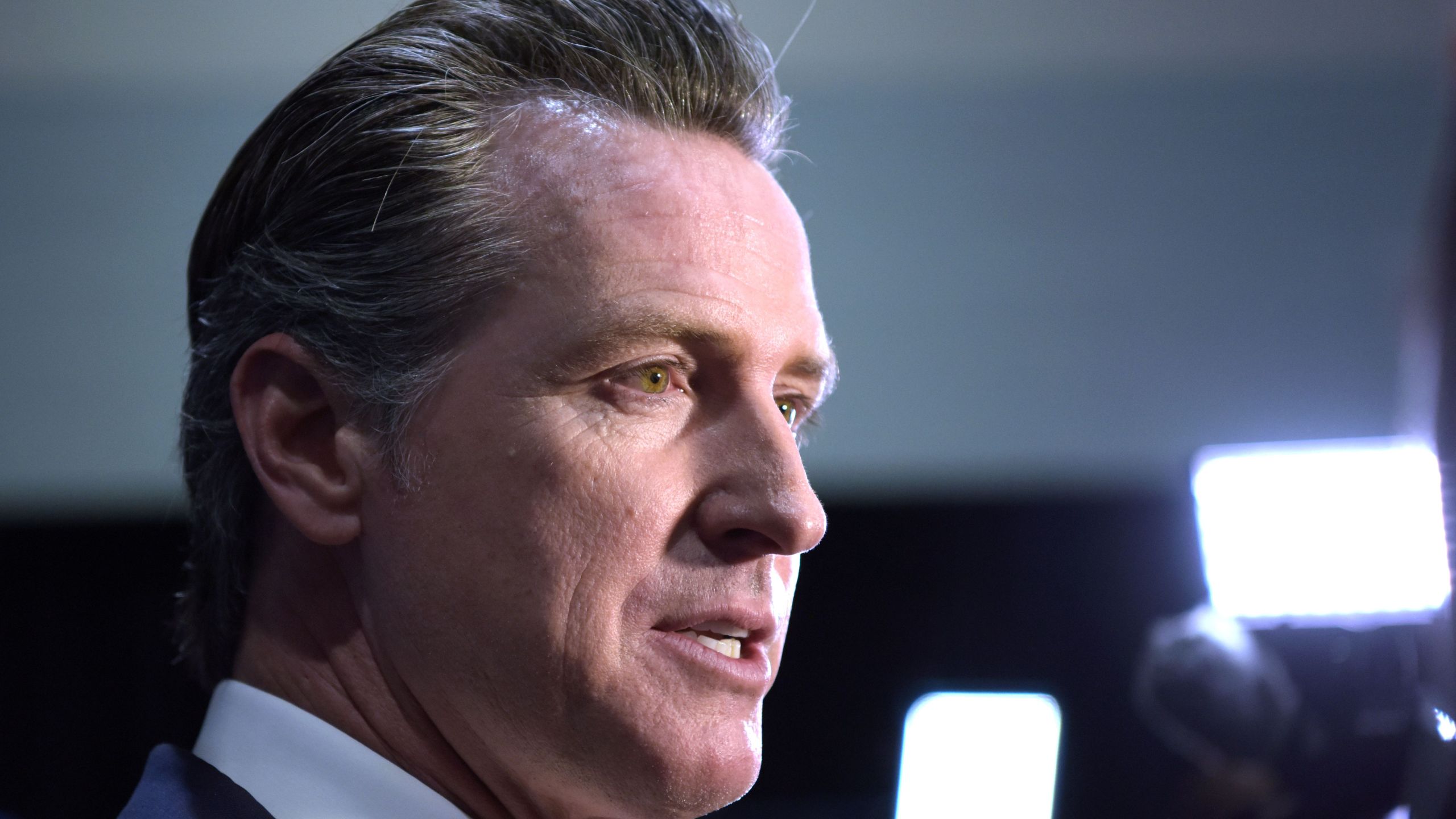 California Governor Gavin Newsom speaks to the press in the spin room at Loyola Marymount University in Los Angeles on Dec. 19, 2019. (AGUSTIN PAULLIER/AFP via Getty Images)