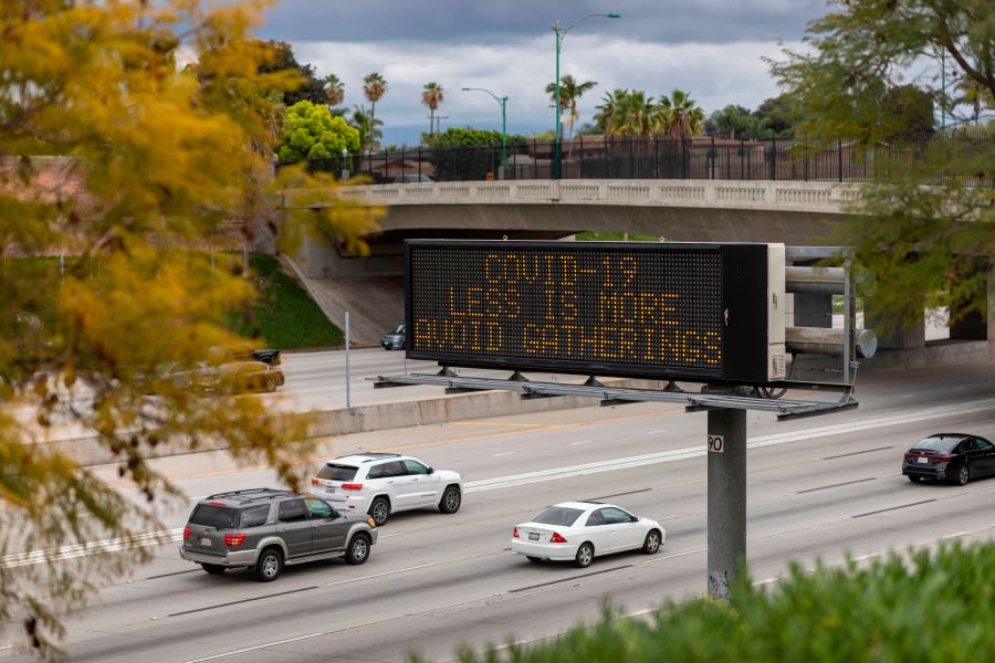 A Caltrans sign warns motorists on the 5 Freeway in Anaheim to not gather in crowds as the threat of coronavirus disease increases on March 14, 2020. (DAVID MCNEW/AFP via Getty Images)