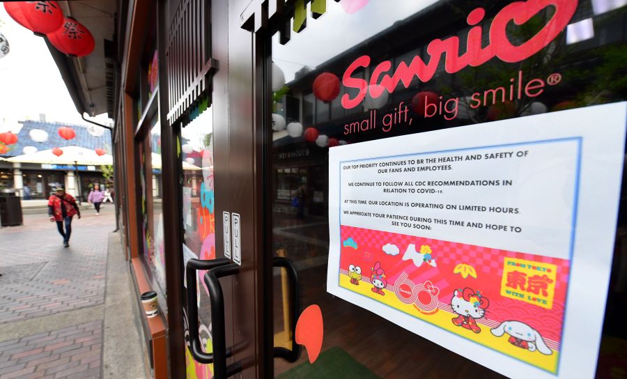 A sign posted on a Sanrio store in the Little Tokyo on March 16, 2020 announces its temporary closure as the coronavirus pandemic brings much of California to a standstill. (Frederic J. Brown/AFP via Getty Images)