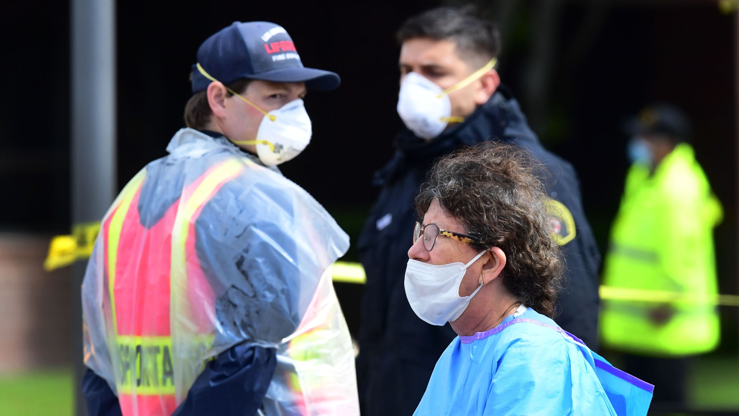 Medical and security personnel wear facemasks amid the coronavirus pandemic on the first day of COVID-19 testing at the Charles R. Drew University of Medicine in south Los Angeles on April 8, 2020. (FREDERIC J. BROWN/AFP via Getty Images)