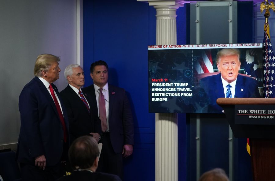 U.S. President Donald Trump and Vice President Mike Pence watch a video during the daily briefing on the novel coronavirus, which causes COVID-19, in the Brady Briefing Room at the White House on April 13, 2020, in Washington, D.C. (MANDEL NGAN / AFP / Getty Images)