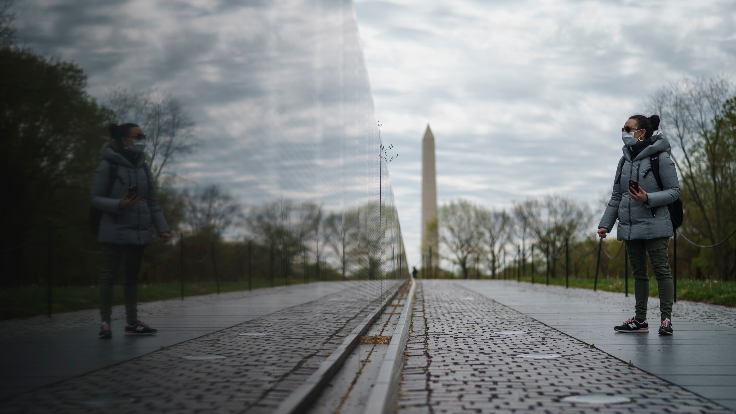 A woman visits an empty Vietnam Veterans Memorial on April 14, 2020, in Washington, D.C. (Drew Angerer/Getty Images)