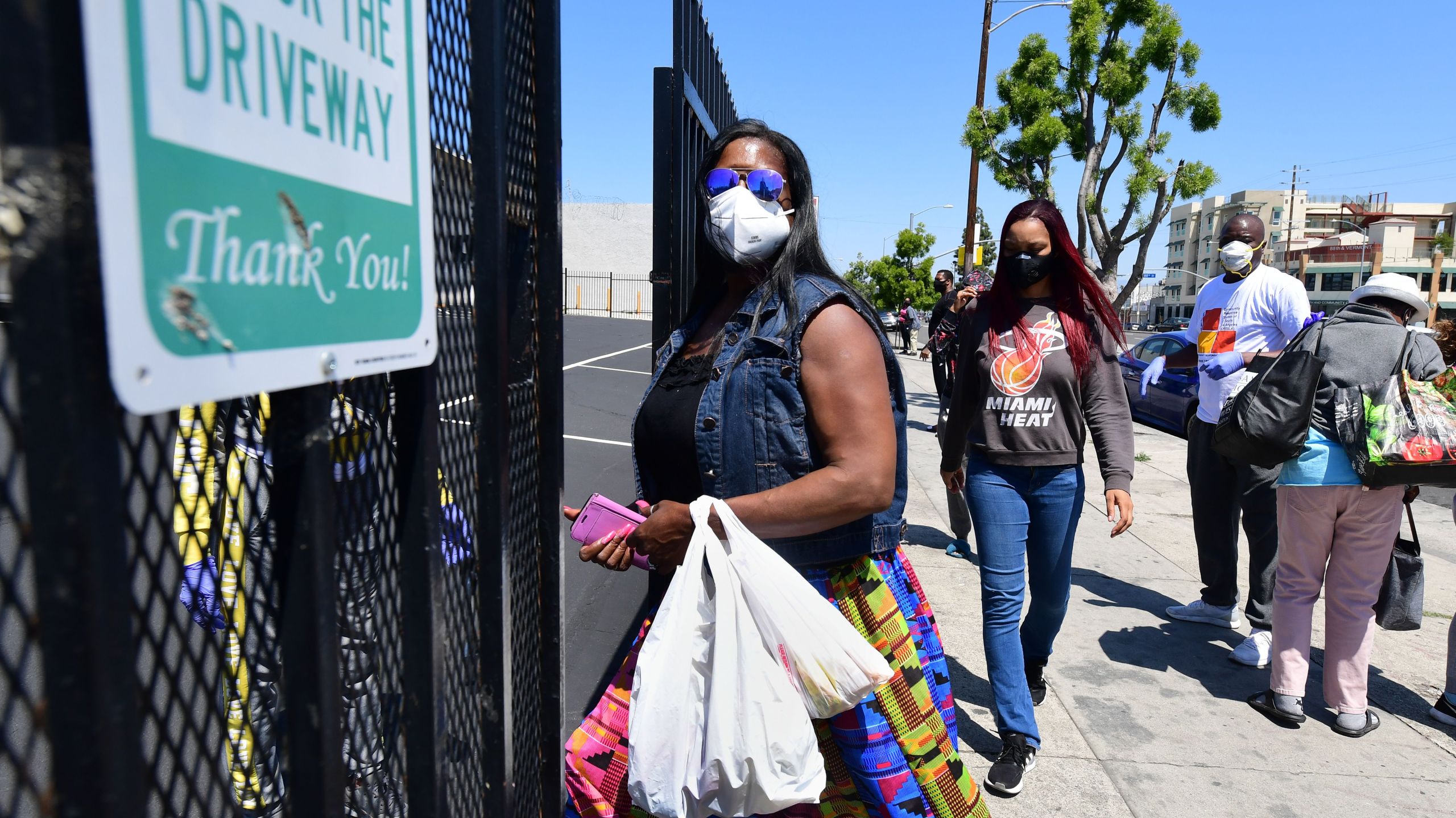 People enter the 88th Street Temple Church of God in Christ for an emergency food distribution on April 14, 2020 in Los Angeles. (Frederic J. Brown/AFP via Getty Images)