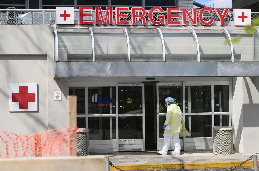 A medical worker enters the emergency room at a hospital on April 15, 2020 in the Brooklyn borough of New York City. (ANGELA WEISS/AFP via Getty Images)