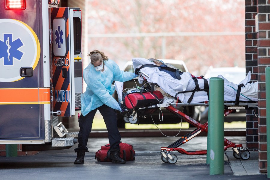 First responders load a patient into an ambulance from a nursing home where multiple people have contracted COVID-19 on April 17, 2020 in Chelsea, Massachusetts. (Scott Eisen/Getty Images)