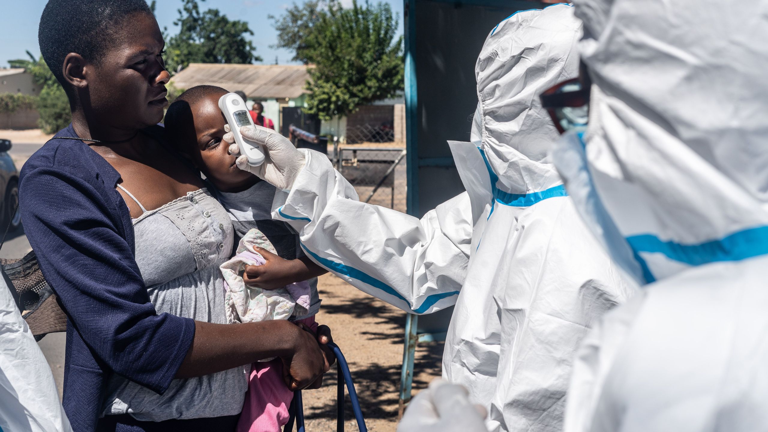 Medical personnel check temperatures of patients visiting Mpilo Hospital in Bulawayo, Zimbabwe on April 25, 2020. The number of cases of coronavirus in Africa is currently low compared to the rest of the planet: nearly 28,000 on the continent against more than 2.7 million worldwide, according to an AFP count. (ZINYANGE AUNTONY/AFP via Getty Images)