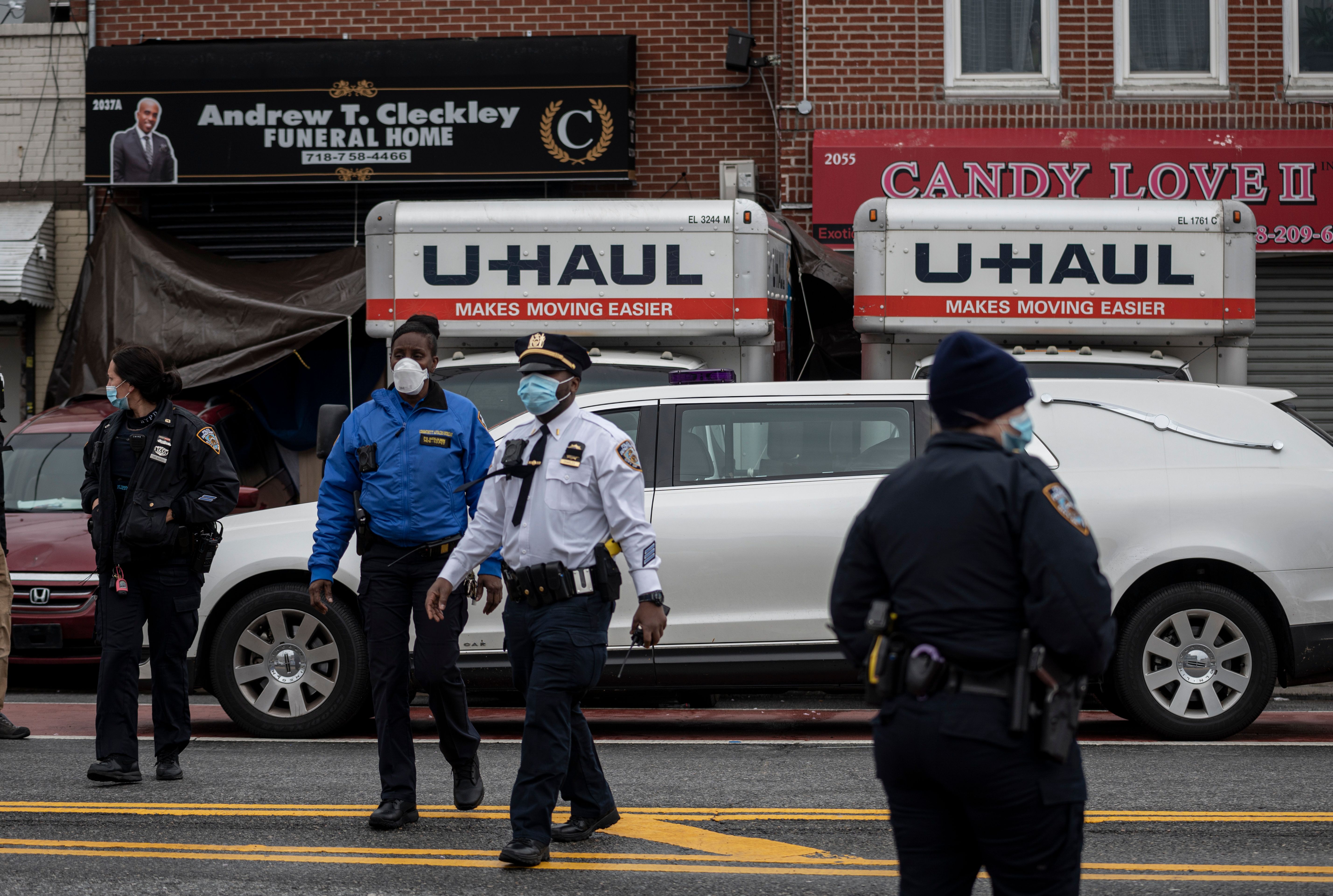 Police are seen outside a funeral home in Brooklyn on April 30, 2020 in New York City. Dozens of bodies have been discovered in unrefrigerated overflow trucks outside the Andrew T. Cleckley Funeral Home, following a complaint of a foul odor. (JOHANNES EISELE/AFP via Getty Images)